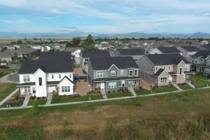 aerial image of a townhome complex and surrounding area with Rocky Mountains in background
